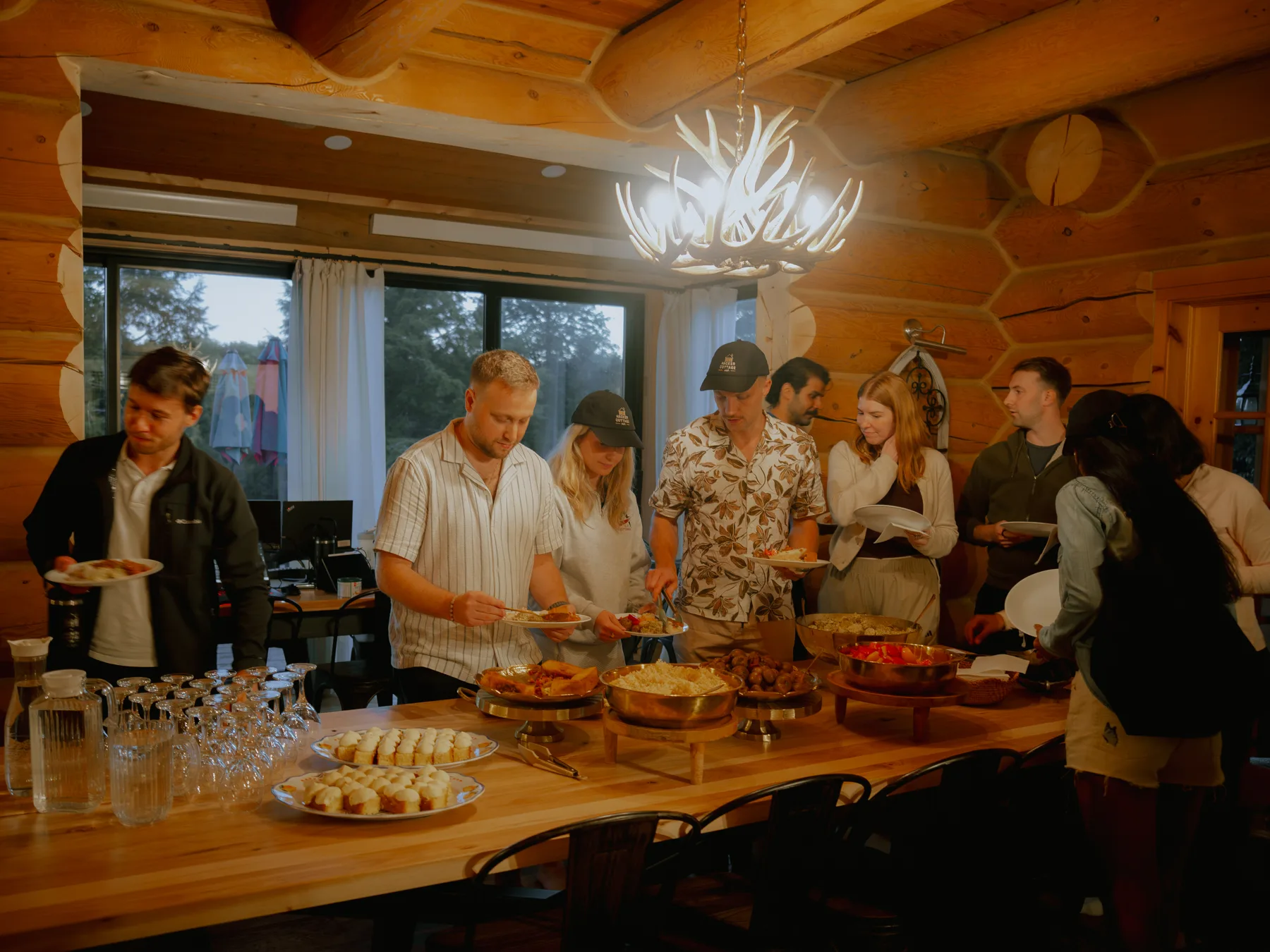Builders serving themselves from a buffet in the chalet dining room