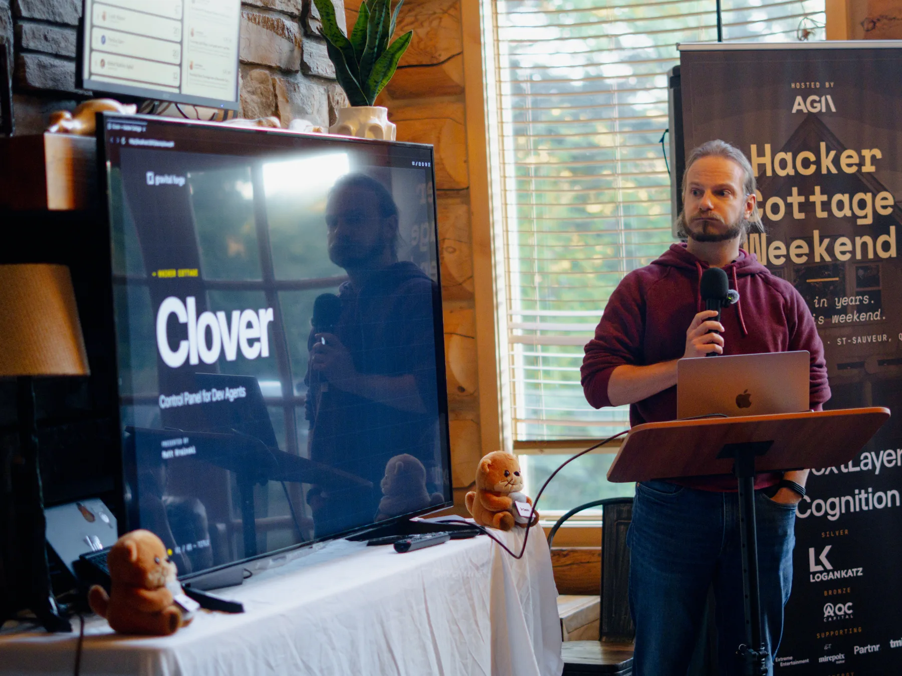 Matt Krainski presenting beside a screen that reads Clover, control panel for dev agents